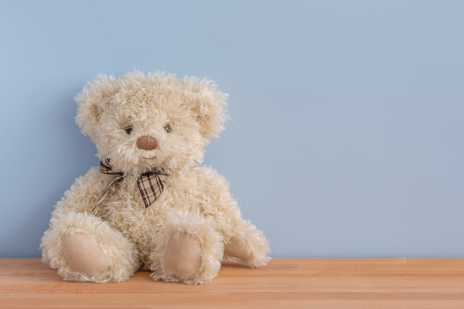 A Teddy Bear on  Wooden Surface 